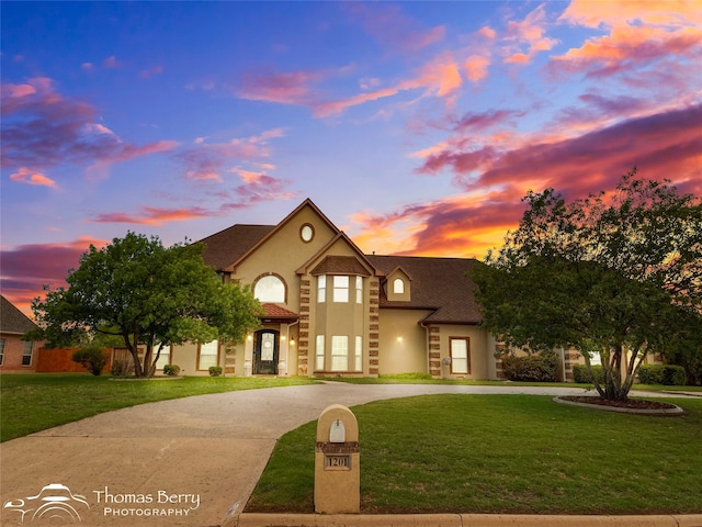 view of front of home with a yard