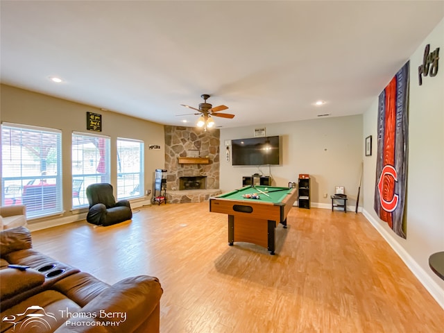 recreation room featuring a fireplace, ceiling fan, billiards, and hardwood / wood-style flooring