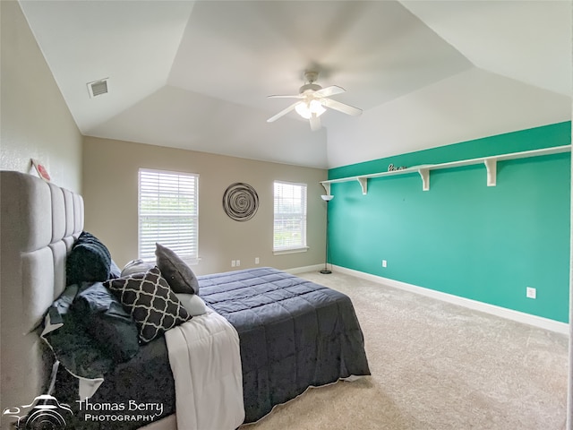 bedroom featuring ceiling fan, lofted ceiling, and carpet flooring