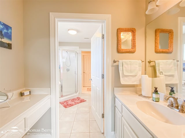 bathroom with vanity, tile patterned floors, and a shower with shower door