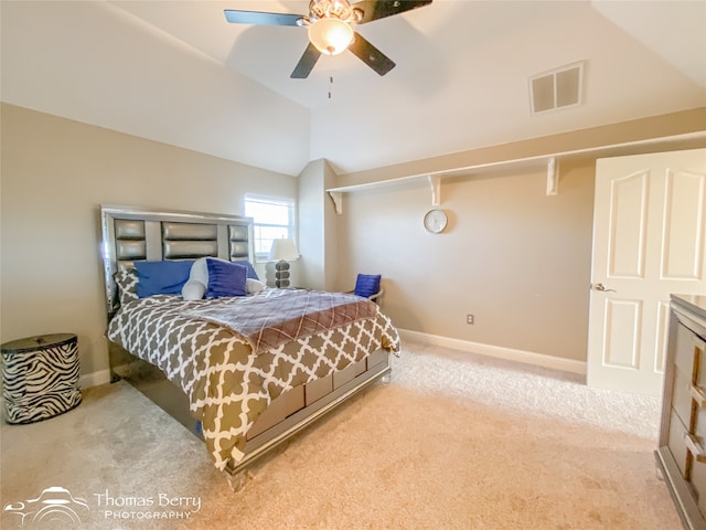 carpeted bedroom featuring vaulted ceiling and ceiling fan