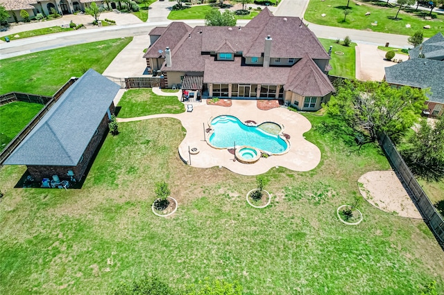 view of swimming pool featuring a lawn and a patio area