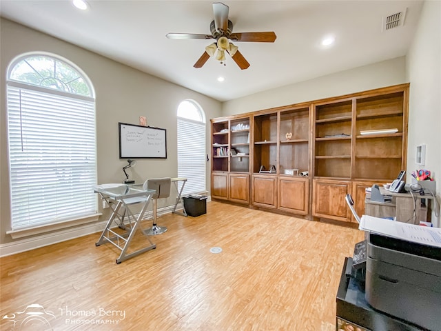 home office featuring light wood-type flooring and ceiling fan