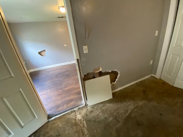 staircase with hardwood / wood-style floors