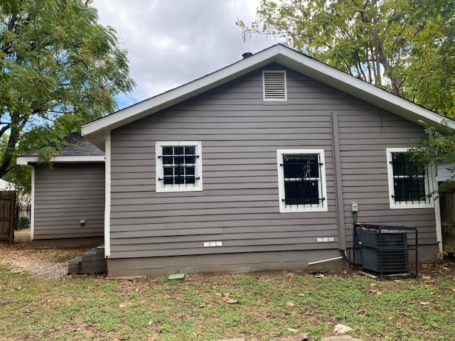 rear view of property featuring central air condition unit