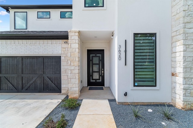 entrance to property featuring a garage