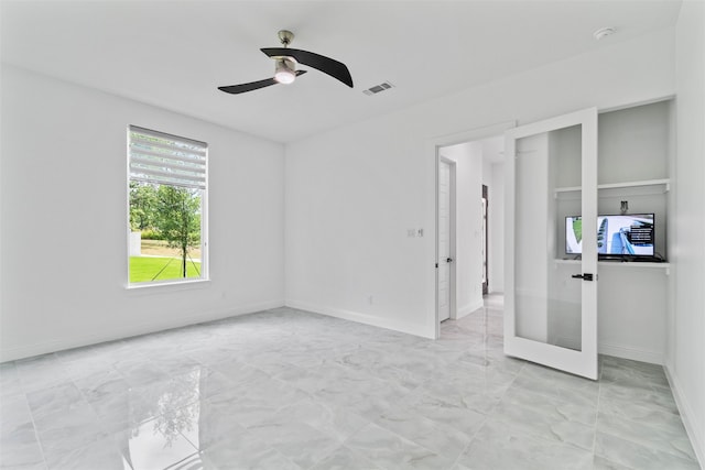 spare room featuring ceiling fan