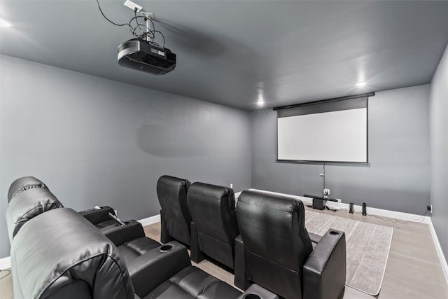 cinema room featuring light hardwood / wood-style flooring