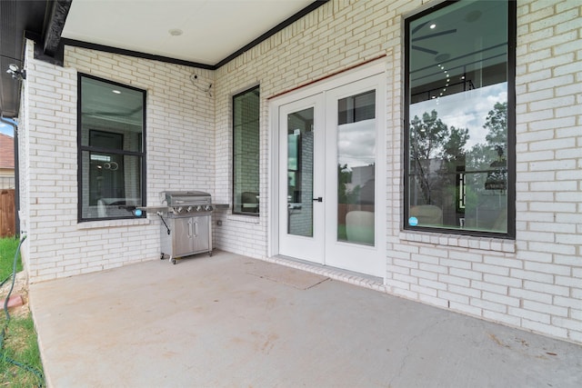 view of patio / terrace featuring a grill and french doors