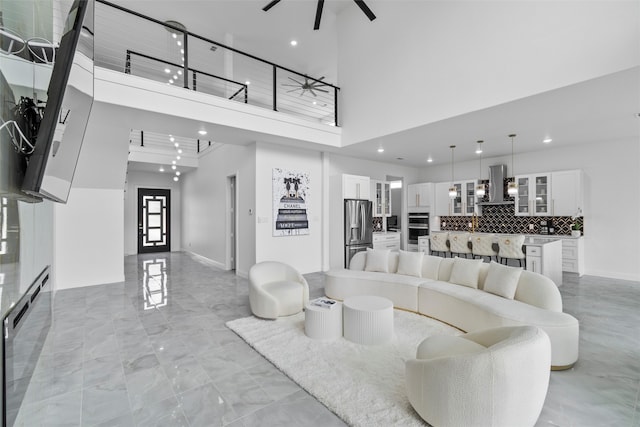 living room with a towering ceiling