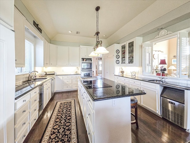 kitchen featuring white cabinetry, a center island, stainless steel appliances, and wine cooler