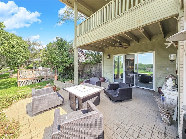 view of patio / terrace with ceiling fan and outdoor lounge area