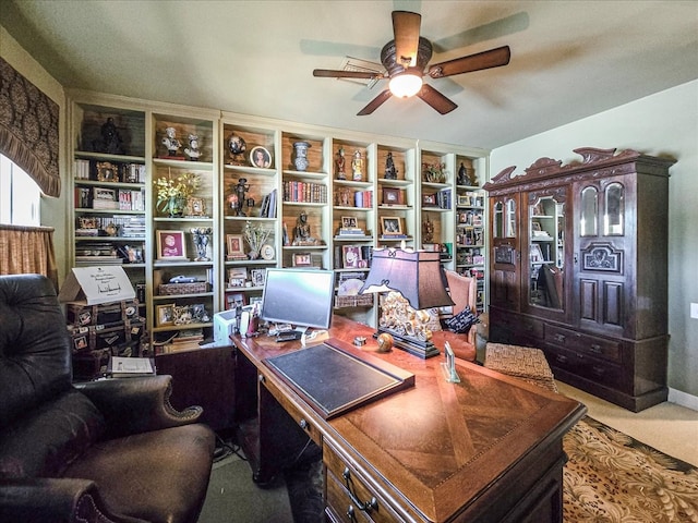 office area with ceiling fan and carpet flooring