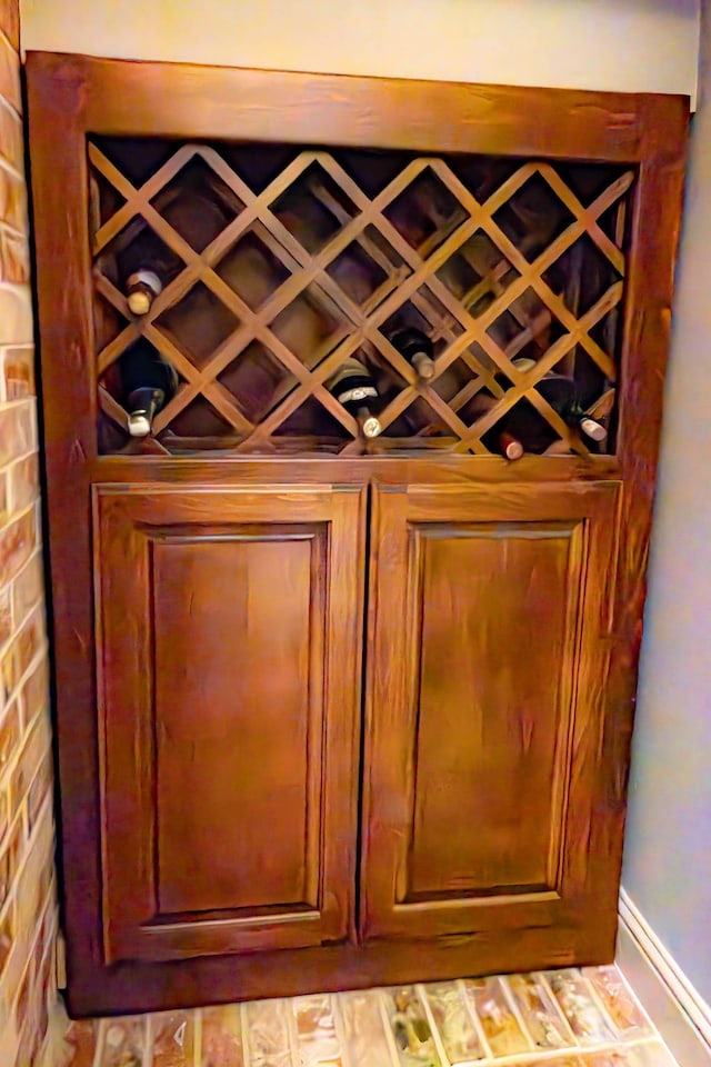 wine cellar featuring brick wall