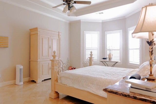 bedroom featuring ceiling fan, ornamental molding, light tile patterned floors, and a raised ceiling