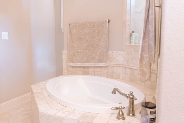 bathroom with tiled tub