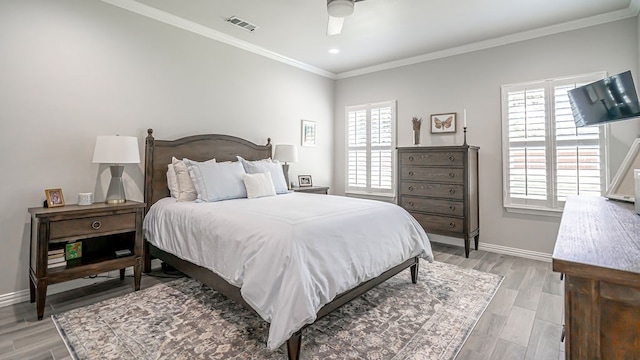 bedroom featuring multiple windows, crown molding, light wood-type flooring, and ceiling fan