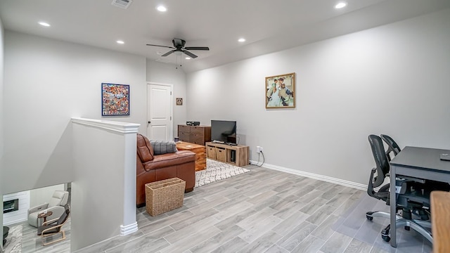 home office featuring ceiling fan and light hardwood / wood-style flooring