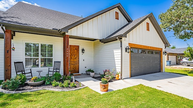 view of front of home with a garage and a front lawn