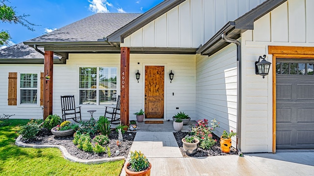 property entrance with a garage and covered porch