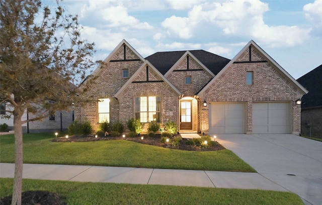 view of front facade with a front yard and a garage