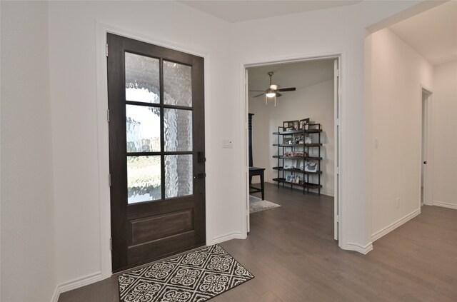 entryway with dark hardwood / wood-style flooring and ceiling fan