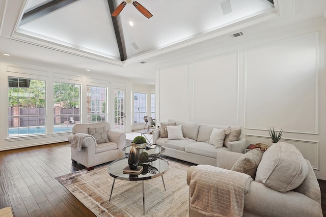 living room with ornamental molding, dark hardwood / wood-style flooring, ceiling fan, and high vaulted ceiling