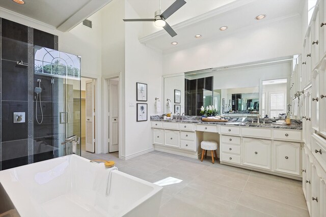 bathroom with vanity, independent shower and bath, tile patterned flooring, a high ceiling, and ceiling fan