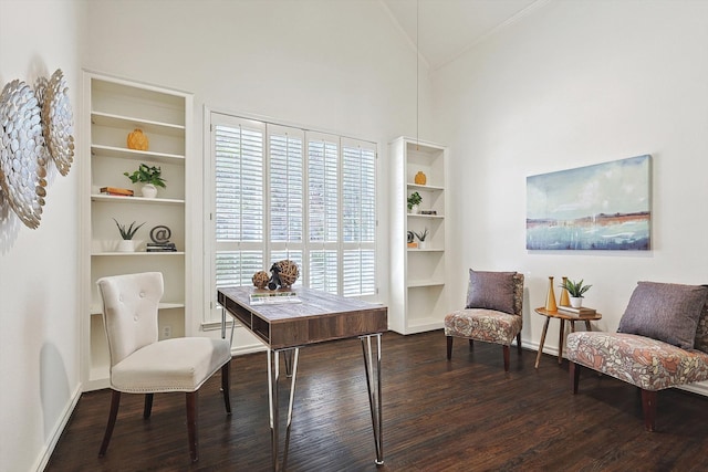 office area with high vaulted ceiling, a healthy amount of sunlight, and dark hardwood / wood-style flooring