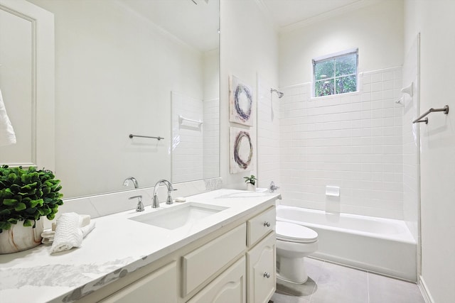 full bathroom with vanity, tile patterned flooring, ornamental molding, toilet, and tiled shower / bath