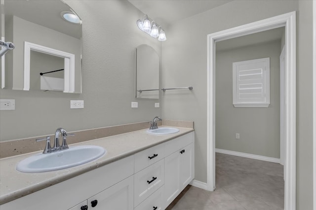 bathroom with tile patterned floors and vanity