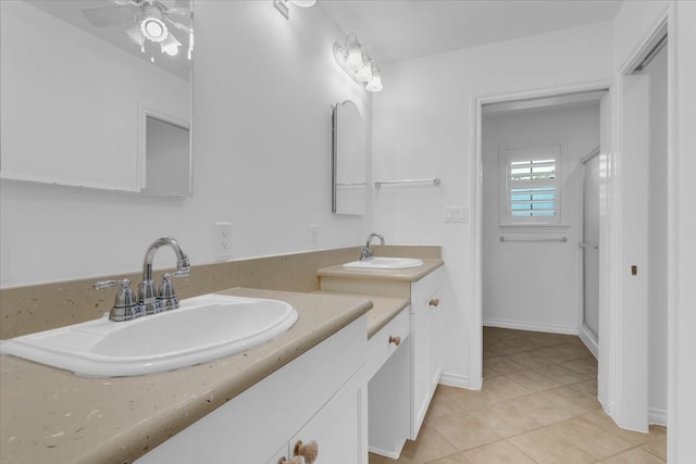 bathroom featuring tile patterned flooring, ceiling fan, and vanity