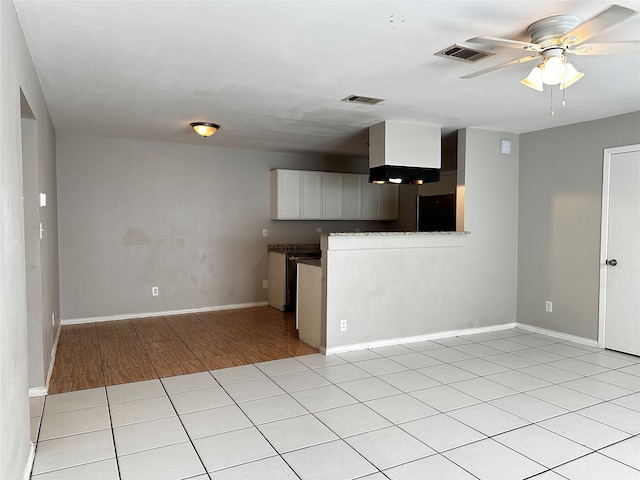 kitchen with ceiling fan, light hardwood / wood-style flooring, and white cabinets