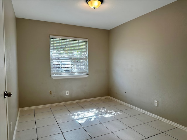 spare room with light tile patterned floors