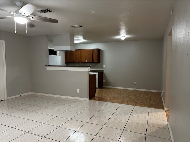 kitchen with ceiling fan and light wood-type flooring