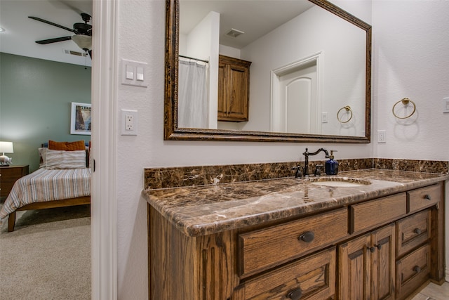 bathroom featuring ceiling fan and vanity