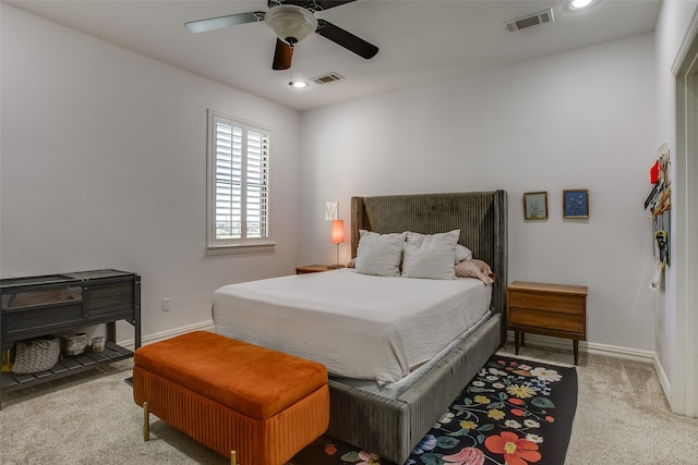 bedroom with light carpet and ceiling fan