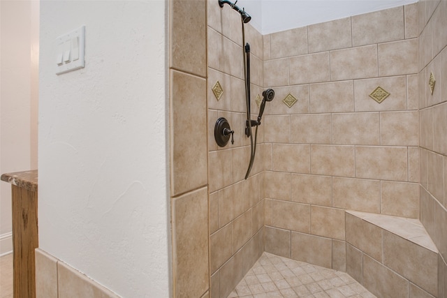 bathroom featuring tiled shower