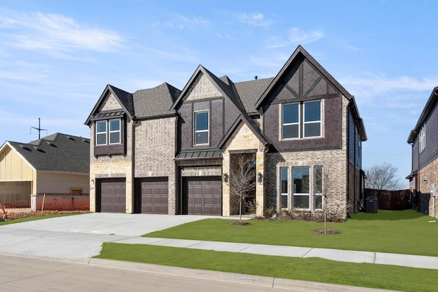 view of front of property with a garage, a front lawn, and central air condition unit