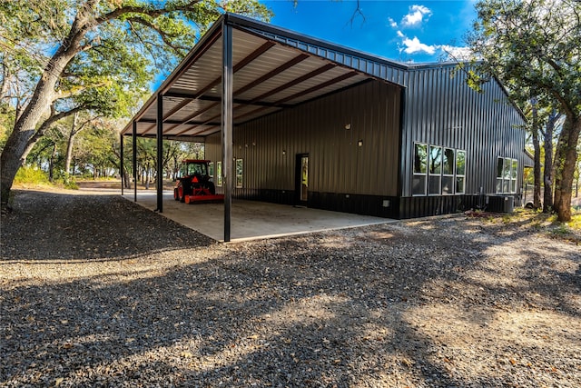 exterior space with a carport and central air condition unit