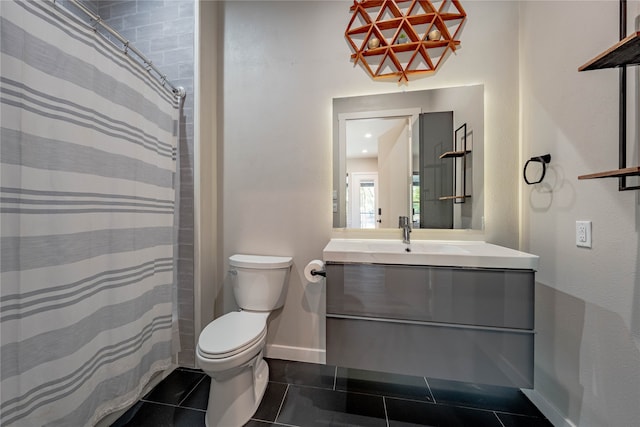 bathroom featuring tile patterned floors, walk in shower, vanity, and toilet