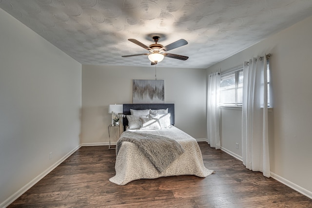 bedroom featuring dark wood-type flooring and ceiling fan