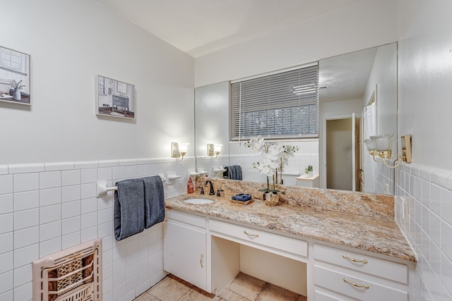 bathroom with vanity, tile walls, heating unit, and tile patterned floors