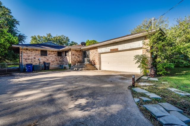 single story home with a garage