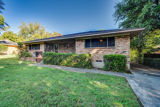 ranch-style home with a front yard