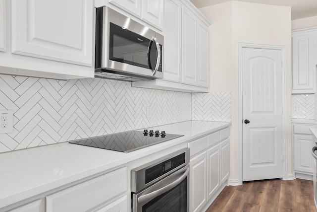 10 Louis Rd, Sherman, TX 75090 - kitchen featuring stainless steel appliances, white cabinets, light countertops, and dark wood finished floors