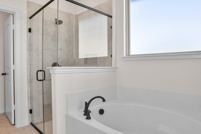 10 Louis Rd, Sherman, TX 75090 - bathroom with a shower stall, a bath, and tile patterned floors
