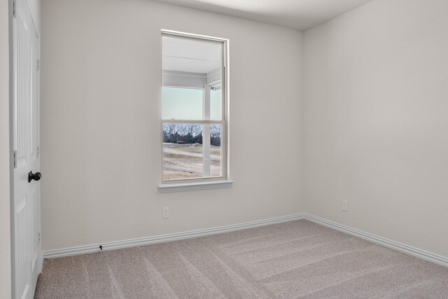 10 Louis Rd, Sherman, TX 75090 - carpeted empty room featuring baseboards