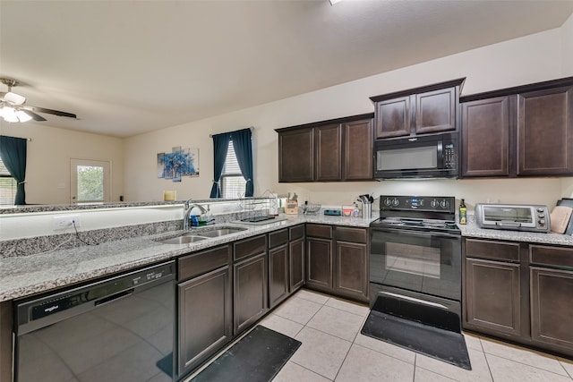 kitchen with black appliances, ceiling fan, light tile patterned floors, and sink