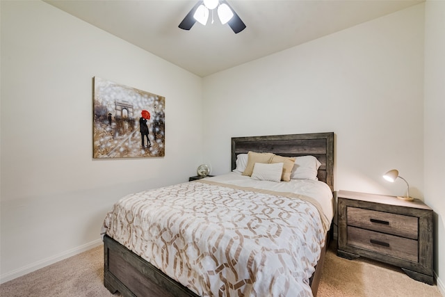 bedroom featuring light carpet and ceiling fan